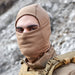 Model wearing Defcon5 Thermal Multi Collar – versatile neck gaiter, face mask, headband, or beanie in Coyote Tan 