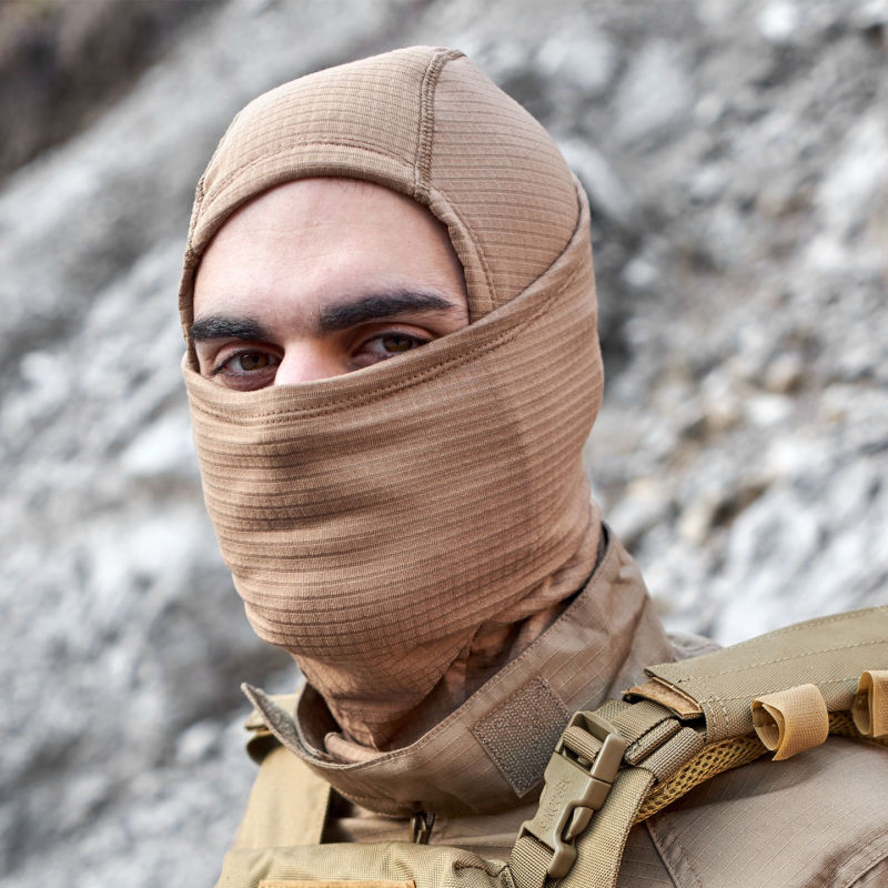 Model wearing Defcon5 Thermal Multi Collar – versatile neck gaiter, face mask, headband, or beanie in Coyote Tan 