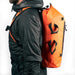 Uncharted Supply Co. | Seventy2 Pro Survival System side profile in orange as worn